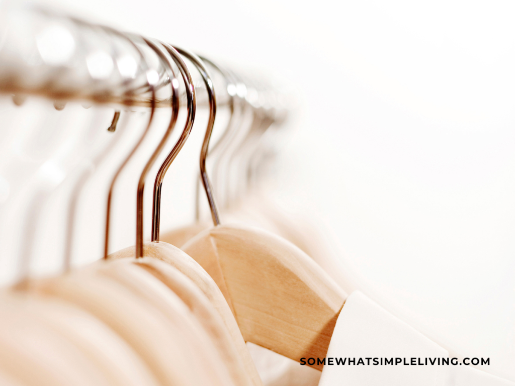wood hangers hanging in a closet