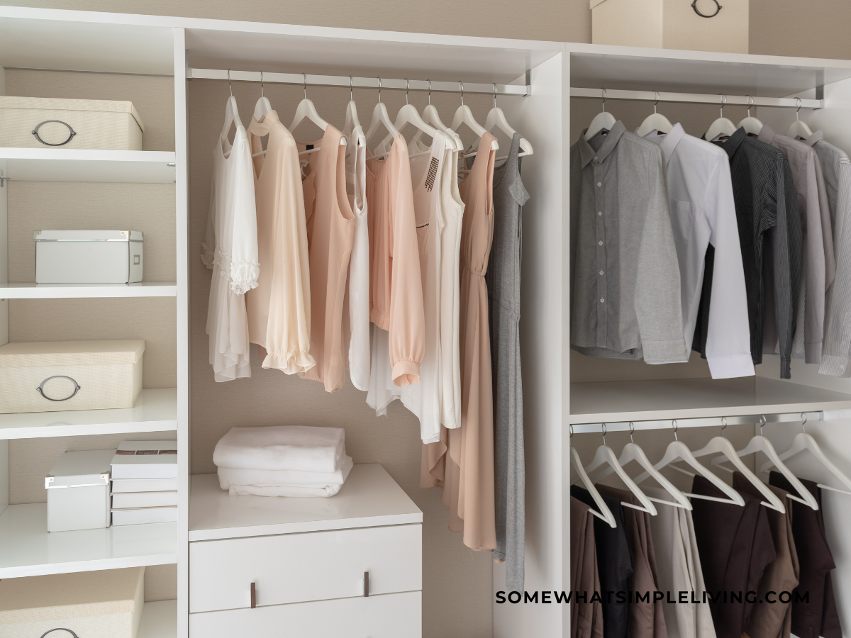 a white closet with organized clothes
