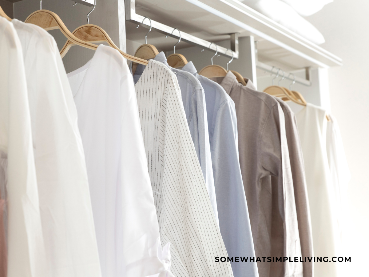 light colored clothing hanging in a closet