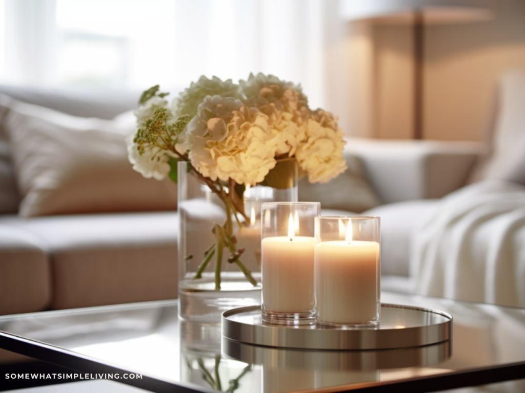 close up of coffee table decor with flowers and a candle