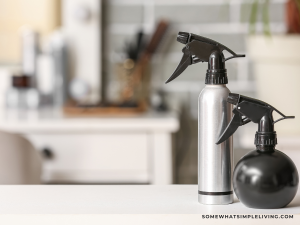 hairspray and toiletries on the bathroom counter