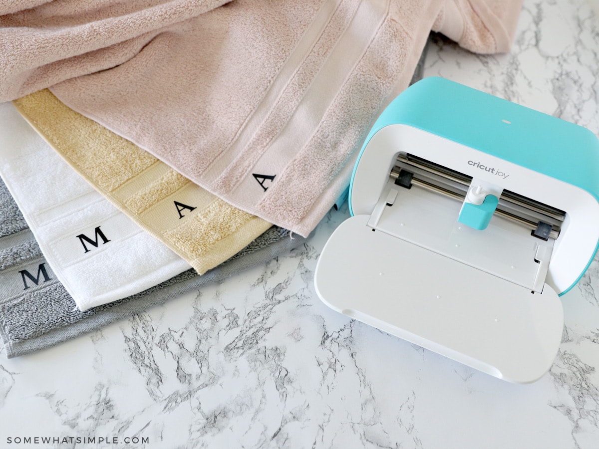 cricut joy next to monogrammed towels