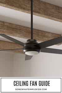 long image of a ceiling fan on a ceiling with wood beams