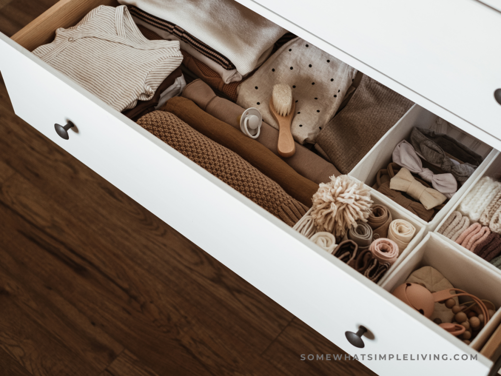clean dresser drawer with baby items inside