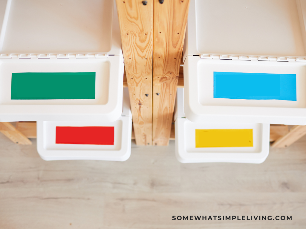 colorful bins stacks on a wood shelf