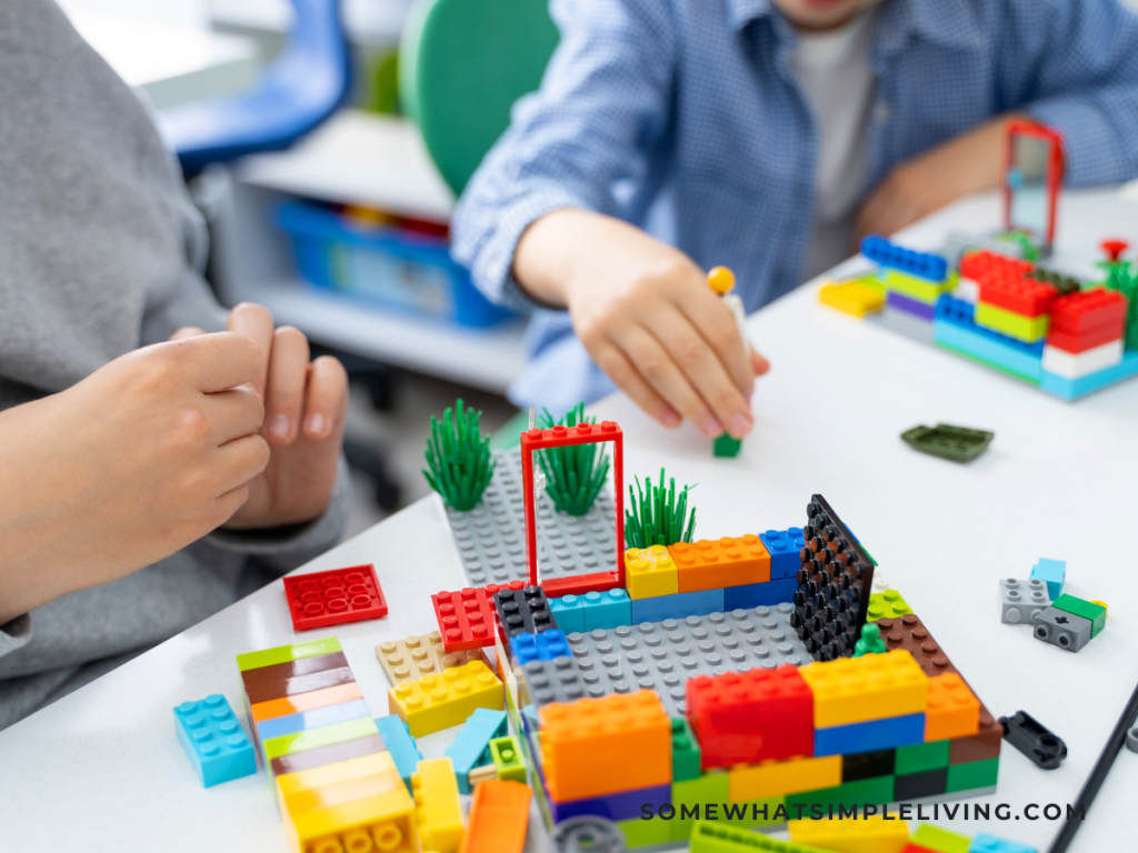 2 boys playing with Legos