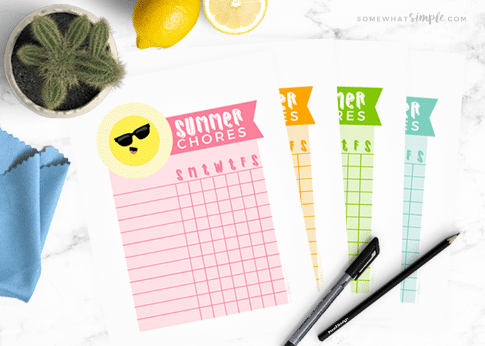 4 colorful summer chore charts on a white counter