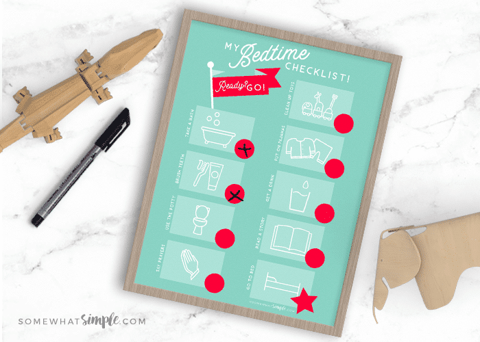 a bedtime job chart printable in a wood frame