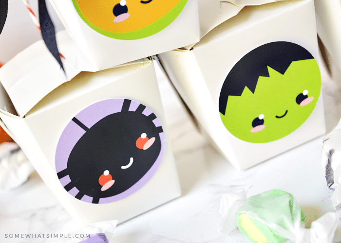 takeout boxes with these halloween printables on the side
