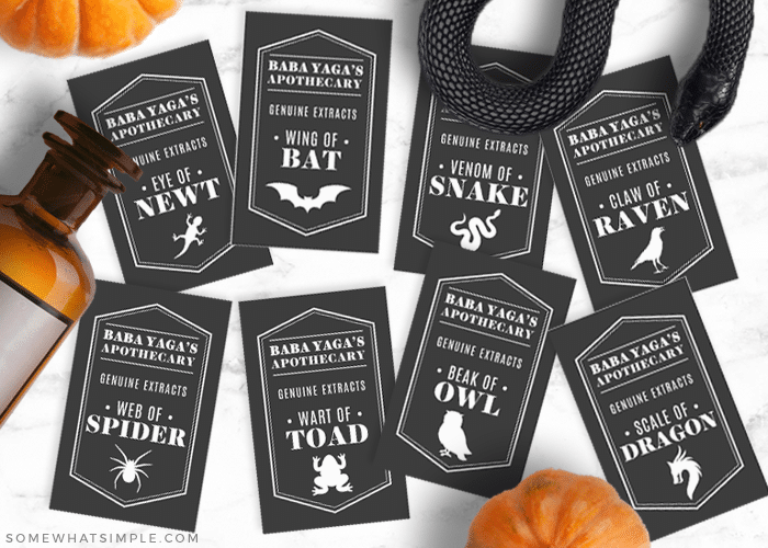 black halloween apothecary labels cut out and on counter