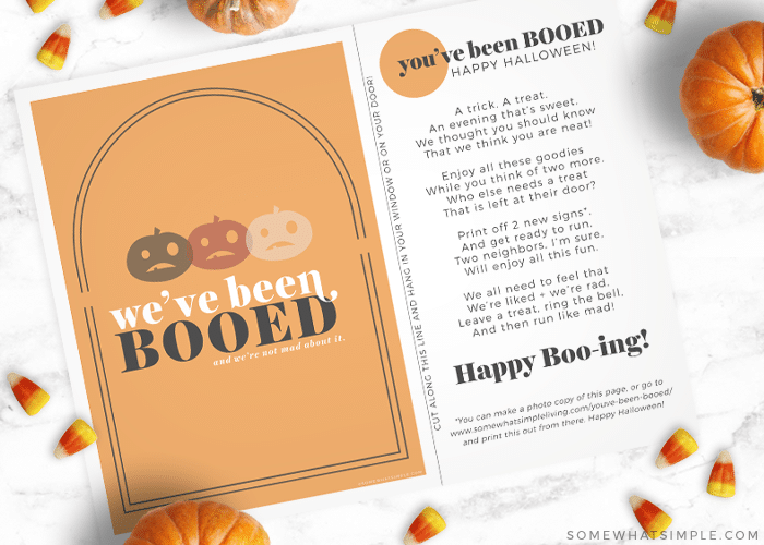 free printable Youve Been Booed sign on the counter with a pumpkin and candy corn