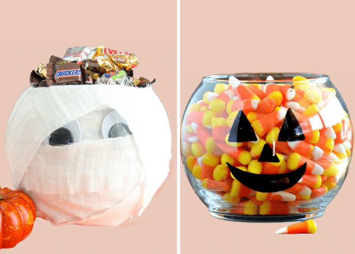two glass bowls decorated like a mummy and a pumpkin filled with candy