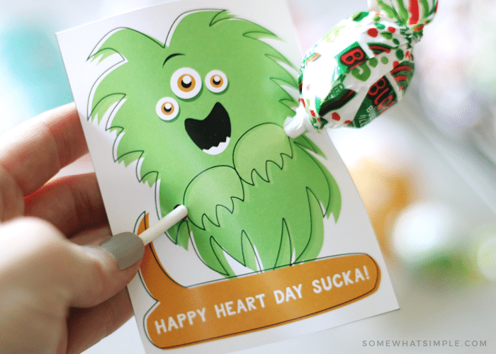 free valentine printable with a monster holding a sucker