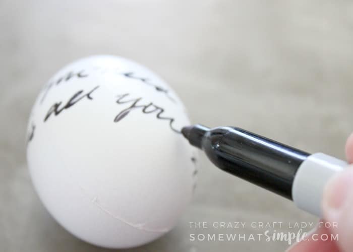 Learn how to make love letter script Easter eggs with this super simple, 2 supply, DIY tutorial. You'll love this black and white Easter egg craft!