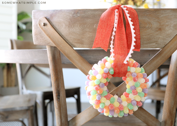 gumdrop wreath hanging from the back of a dining chair