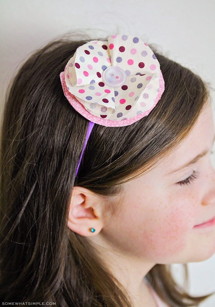 a headband with a fabric flower on top