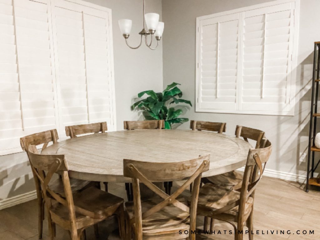 plain dining room before the makeover with round wood table