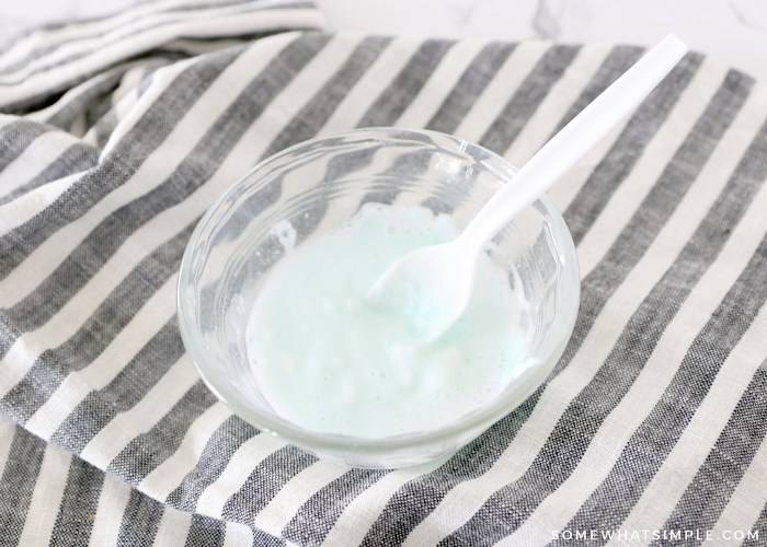 making a paste to clean an iron with baking soda, toothpaste and vinegar