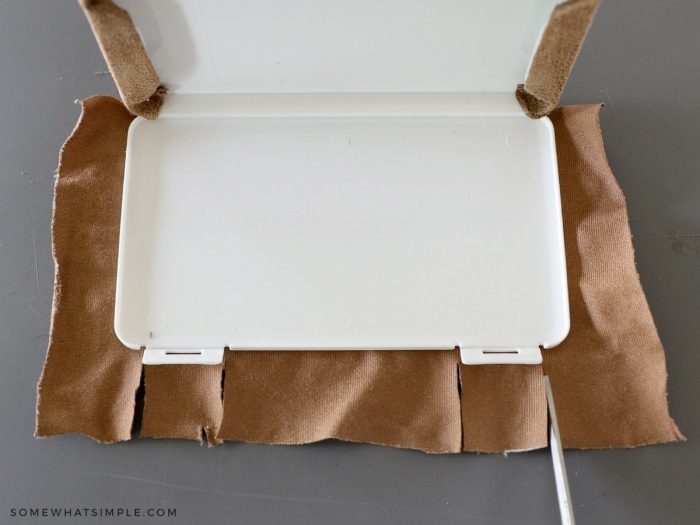 covering the top part of a wipe case with leather fabric