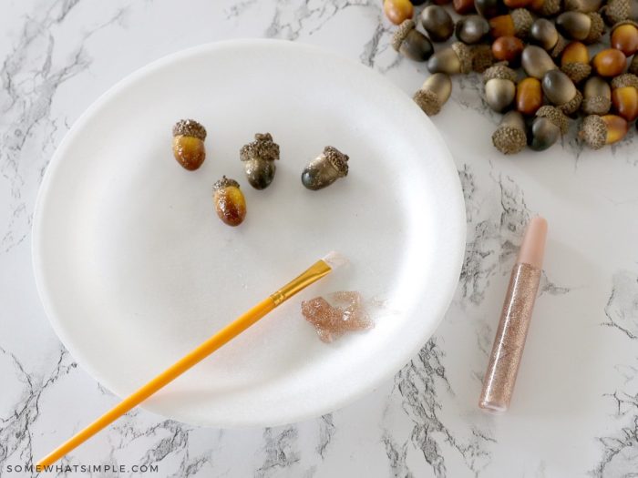 painting acorns with glitter glue