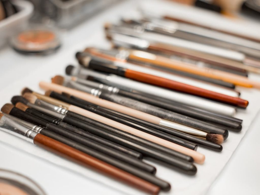 makeup brushes laid out on the counter