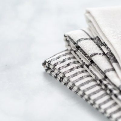 stack of kitchen towels on a white counter