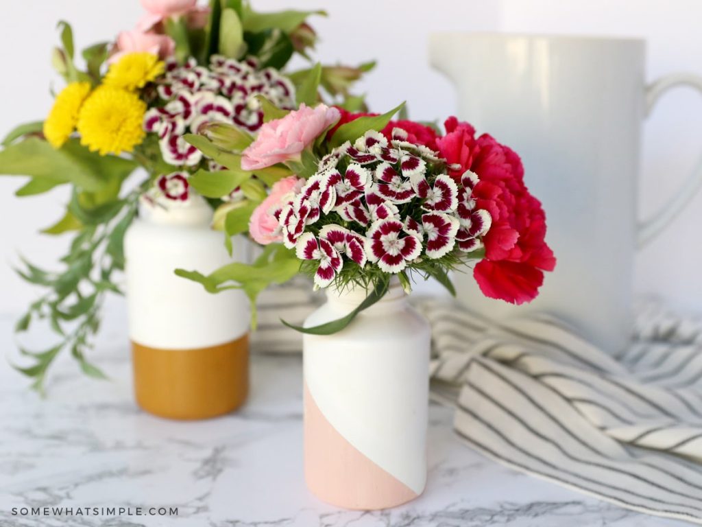 painted pill bottles with flowers inside