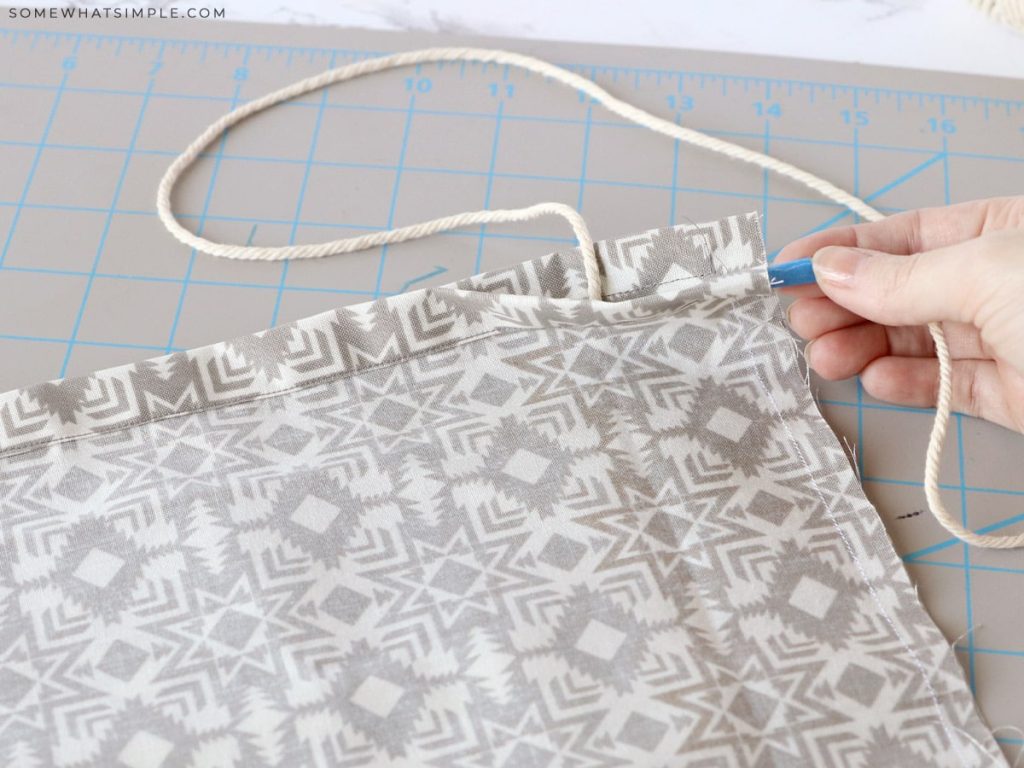 adding twine to a sewn tote
