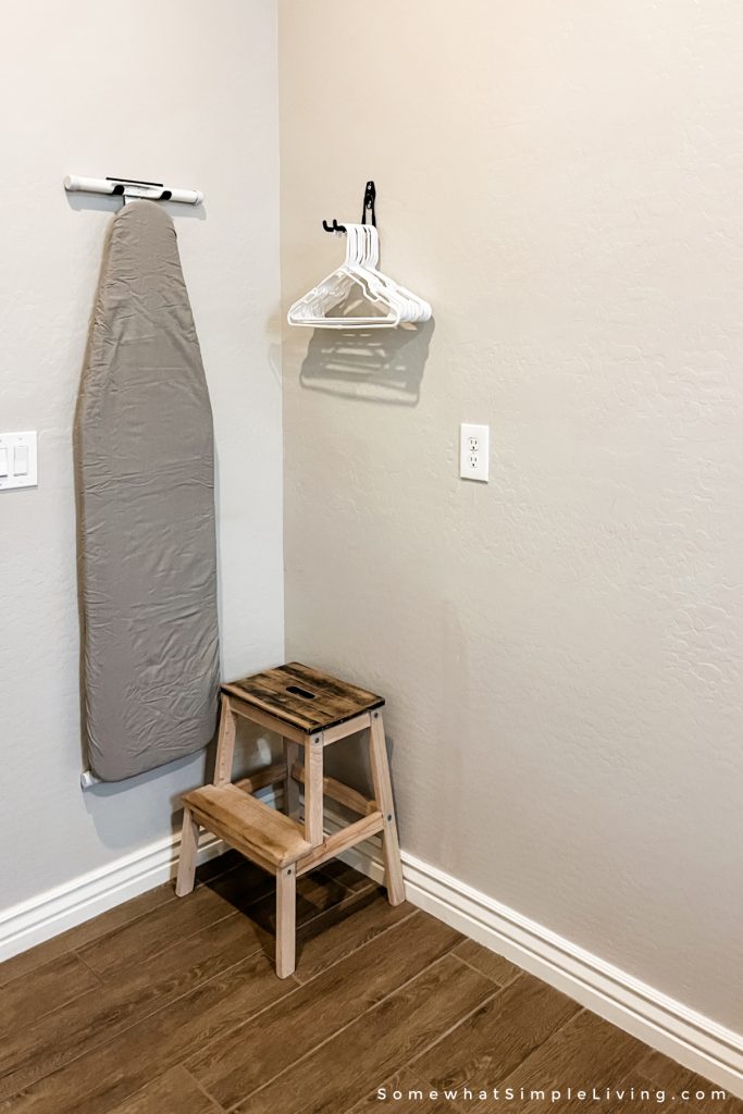 Ironing board hanging on the wall
