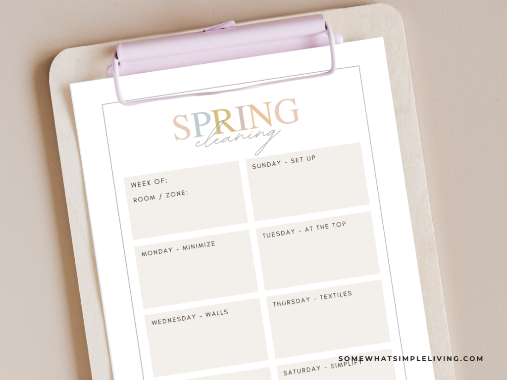 spring cleaning checklist on a pink clipboard