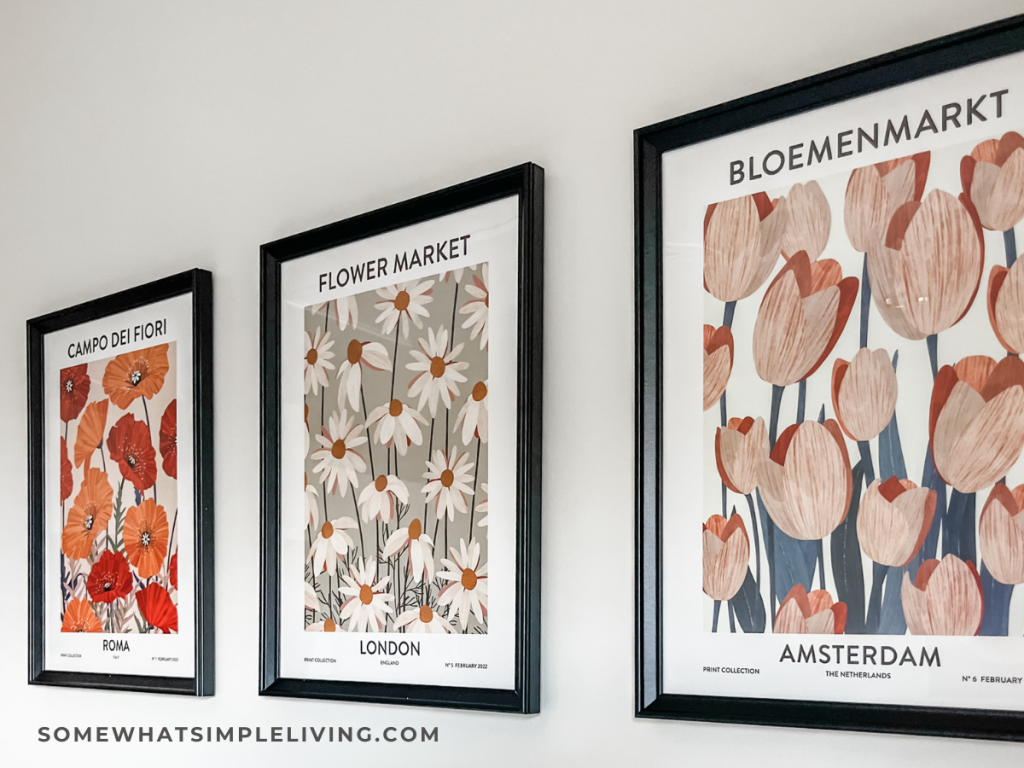 floral artwork on a wall in black frames