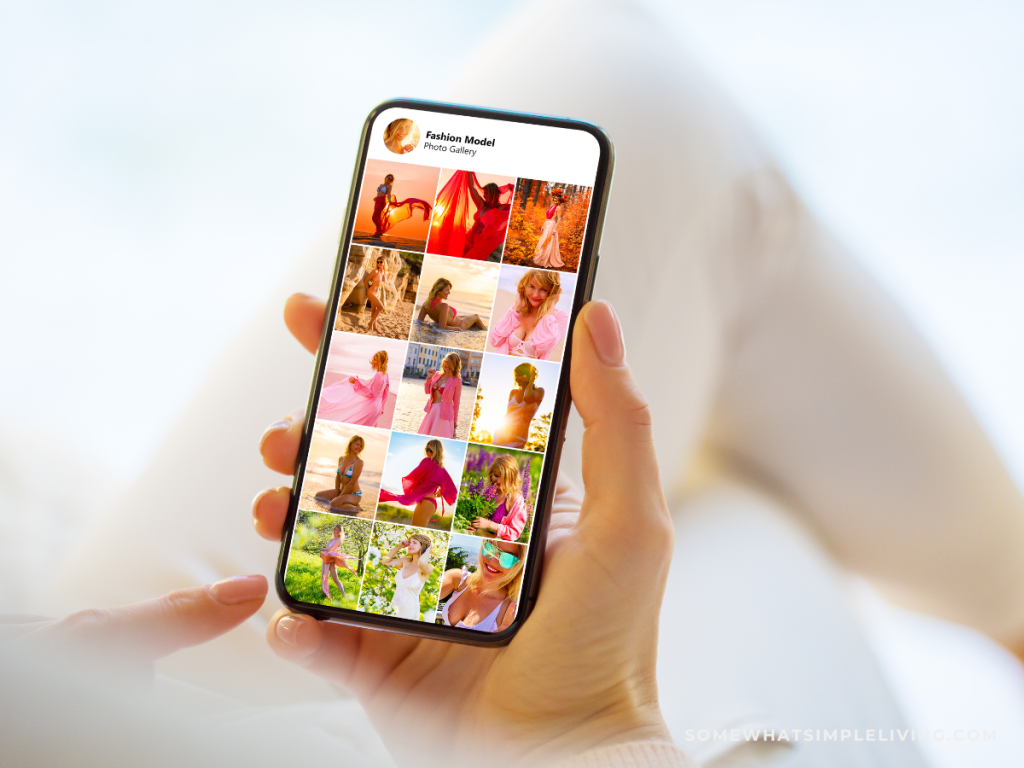 woman's hand holding a phone showing social media