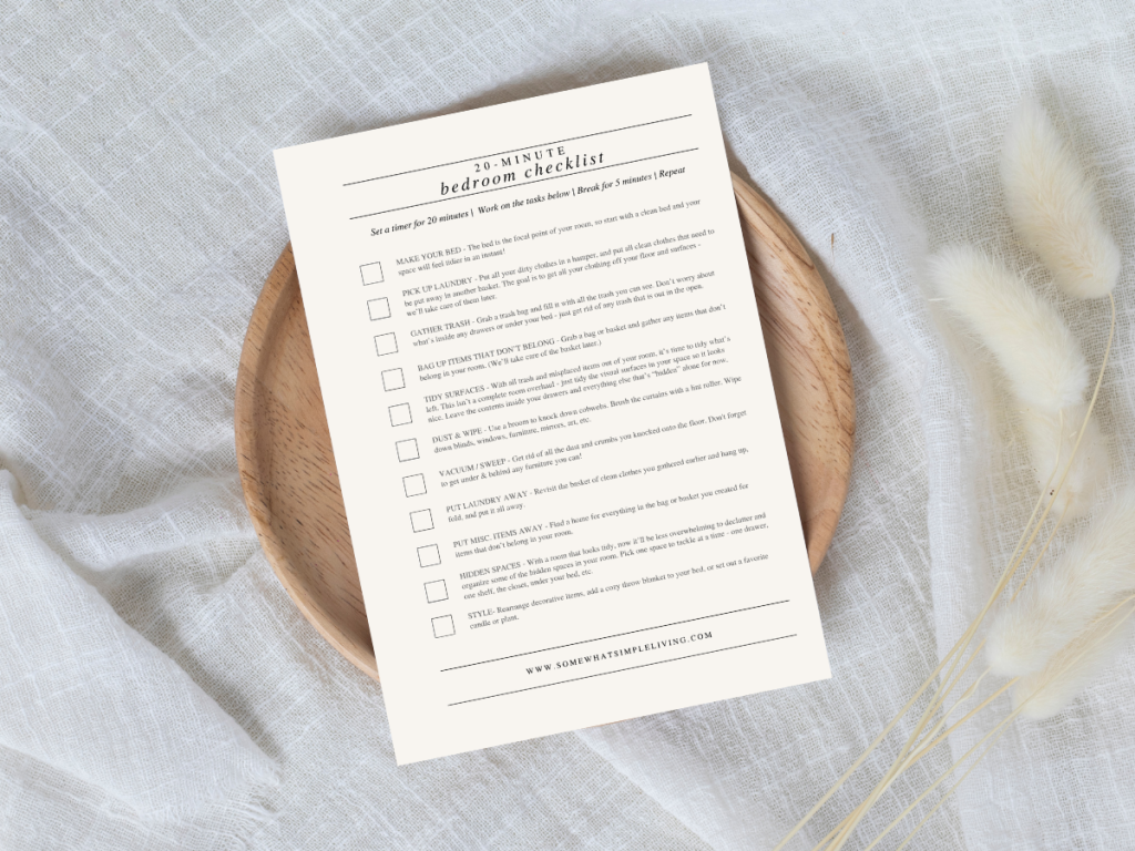 bedroom cleaning checklist printed and laying on a bed