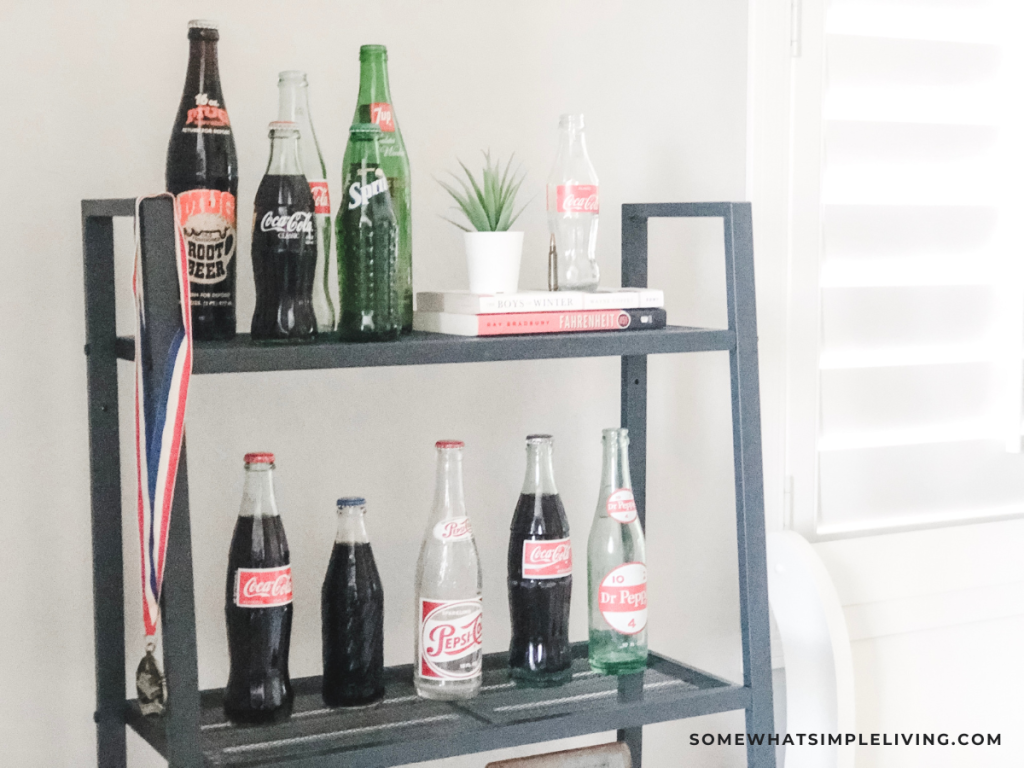 a shelf lined with soda bottles