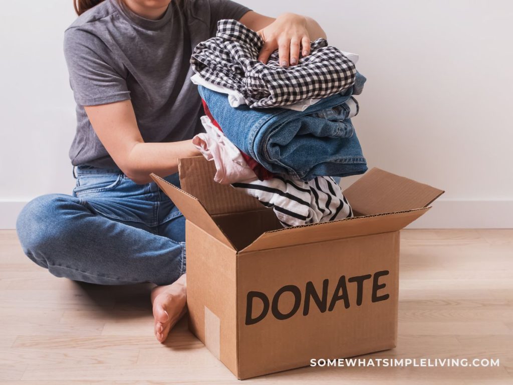 Donate box being filled with clothes