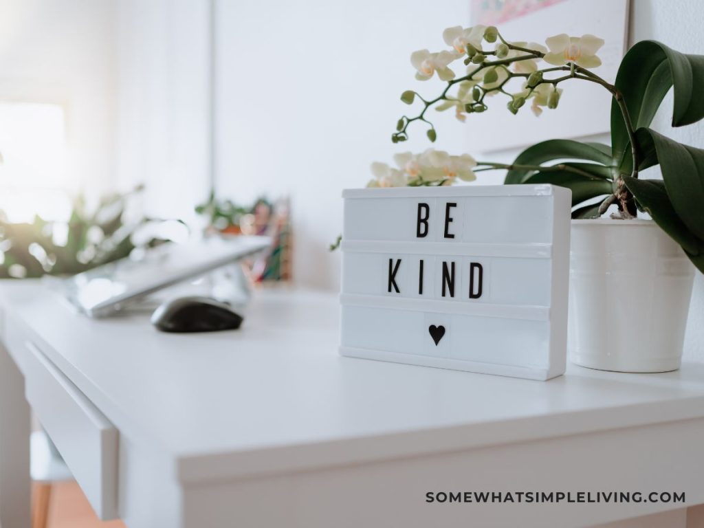 Sign on a desk with a "be kind"