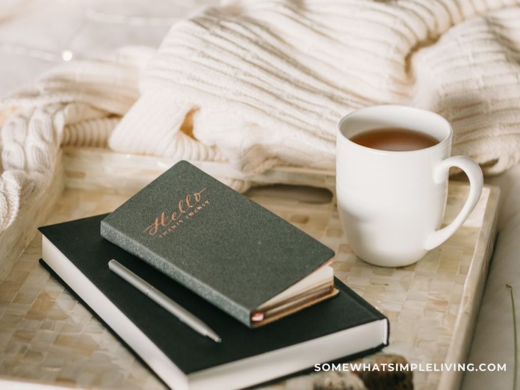 Journal and hot coca on a blanket