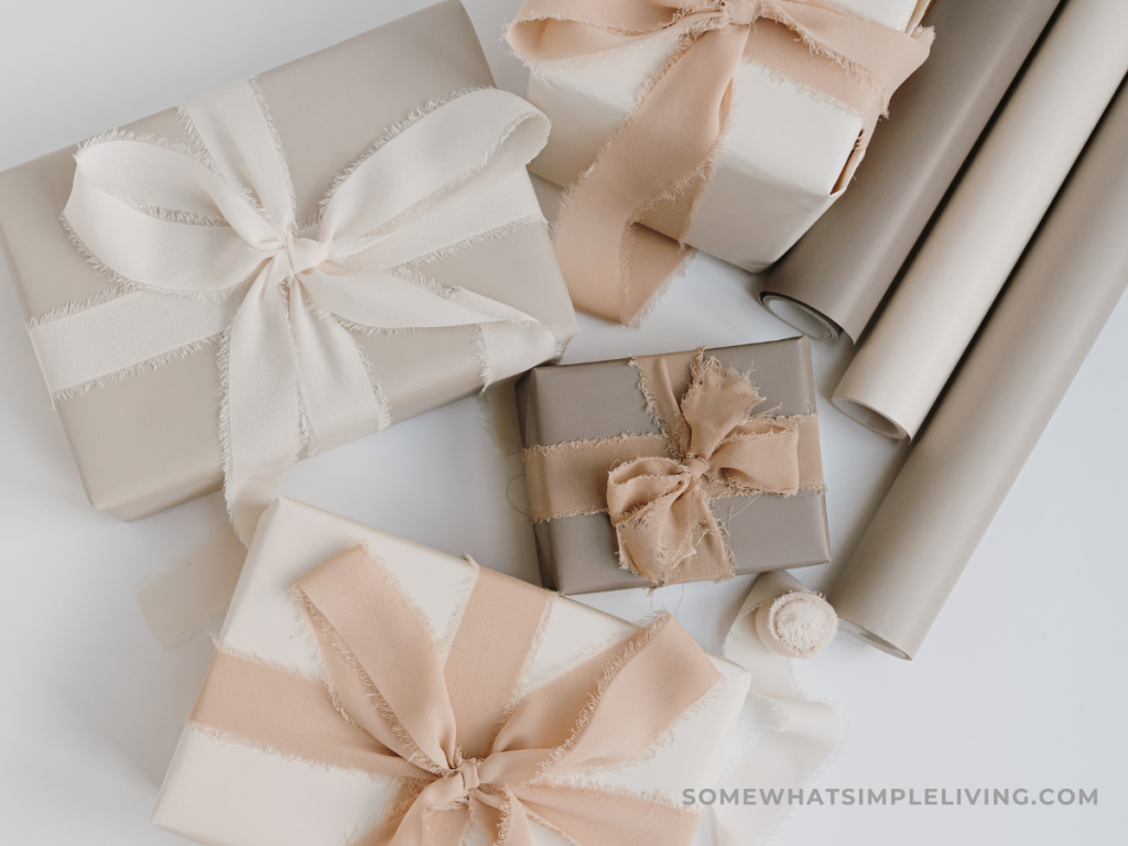 wrapped gifts next to wrapping supplies