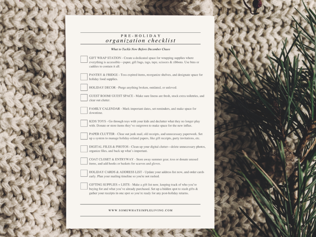 holiday organization checklist on a chunky sweater with christmas greenery