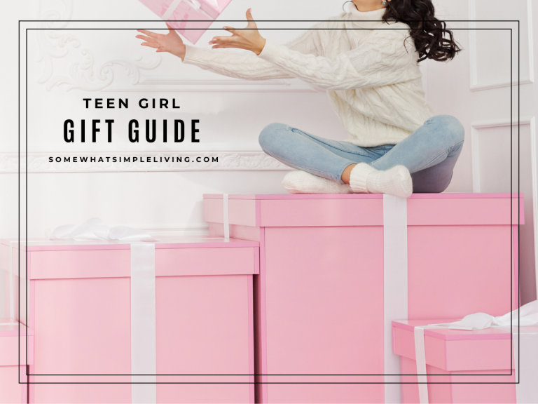 teen girl sitting on top of pink gift boxes