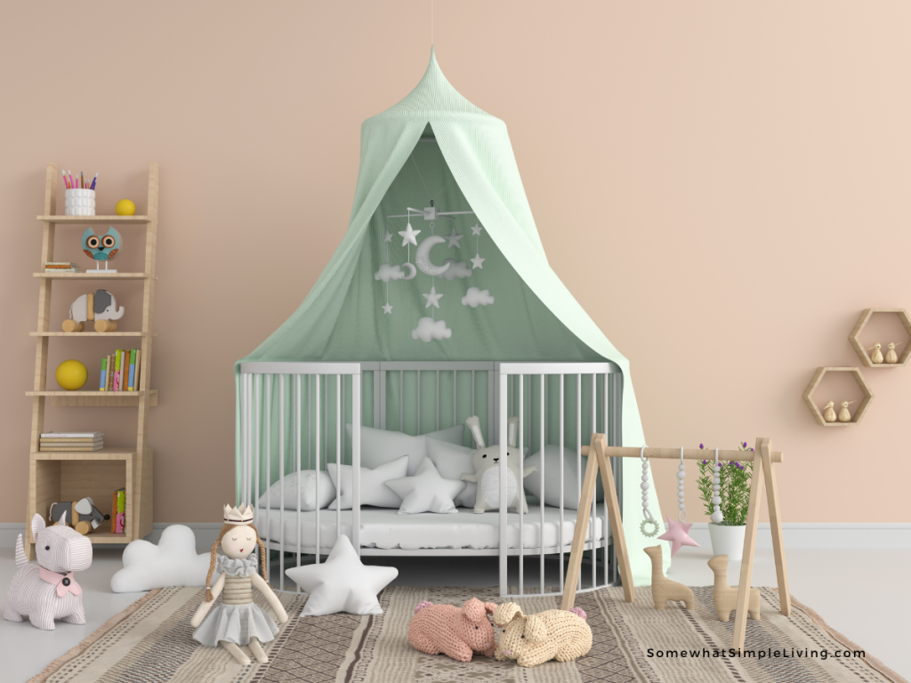 colorful pink playroom with a white playpen and mint green tent. toys are scattered about on the floor