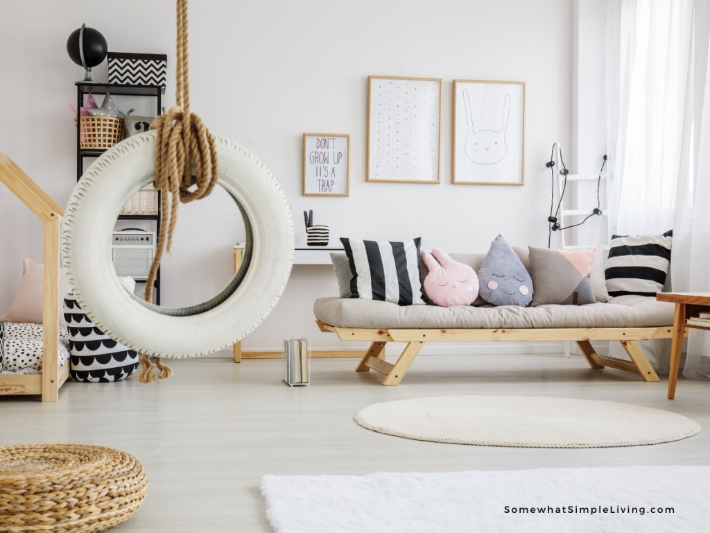 white tire swing in a blank and white playroom