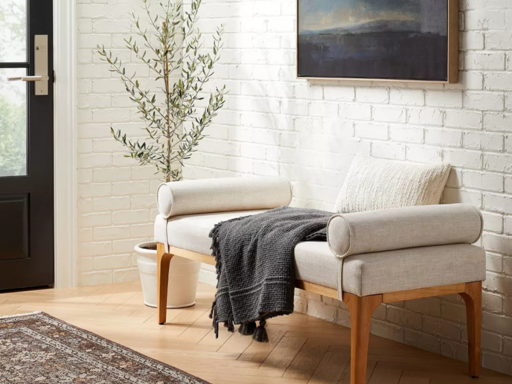 upholstered bench in an entry way