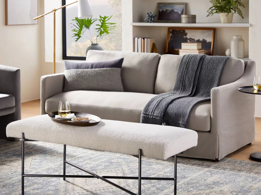 upholstered bench used as a coffee table