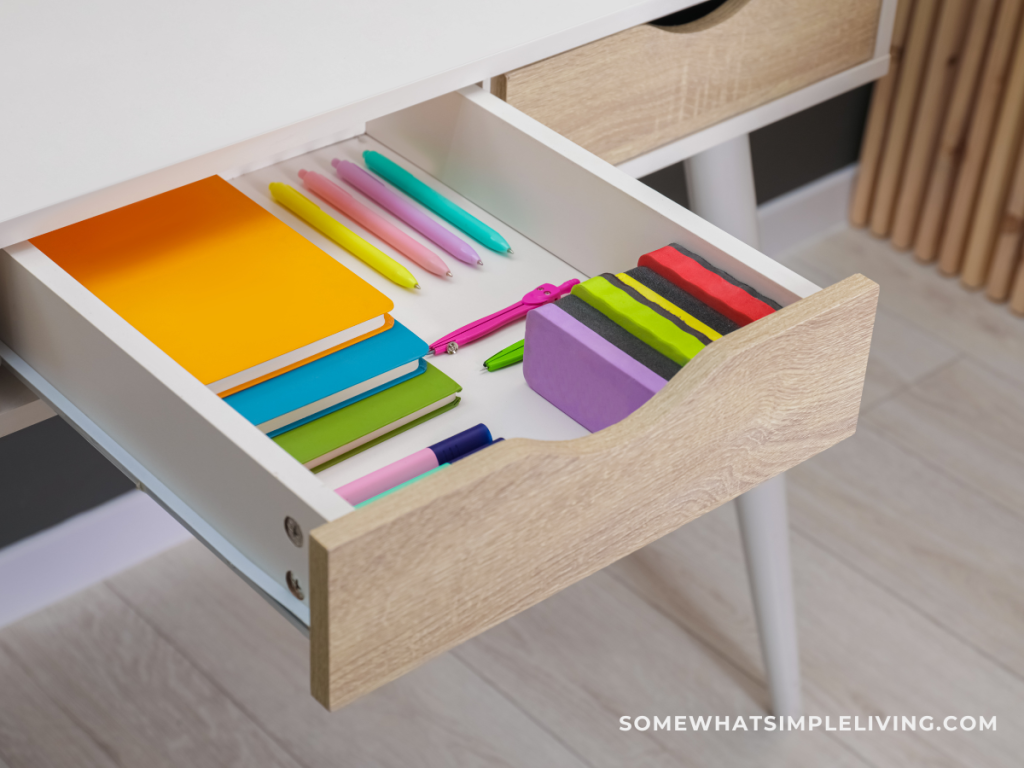 desk drawer with colorful paper inside