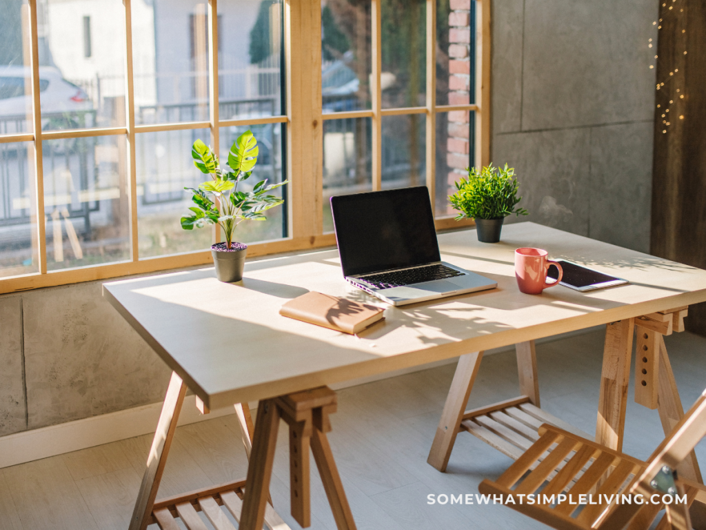 wood desk in front of a window