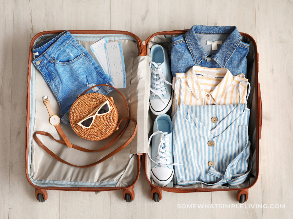 open suitcase packed with vacation clothes