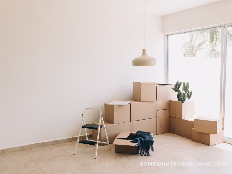 moving boxes in the corner of an empty room