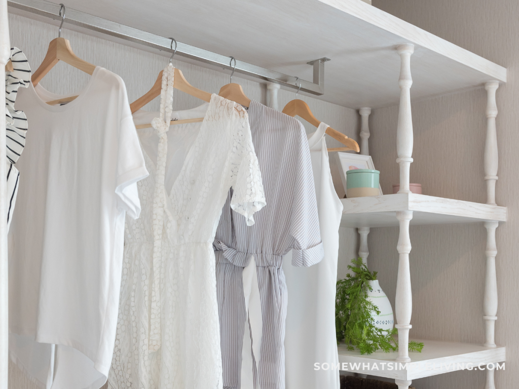 classic natural-colored clothes hanging in a closet 