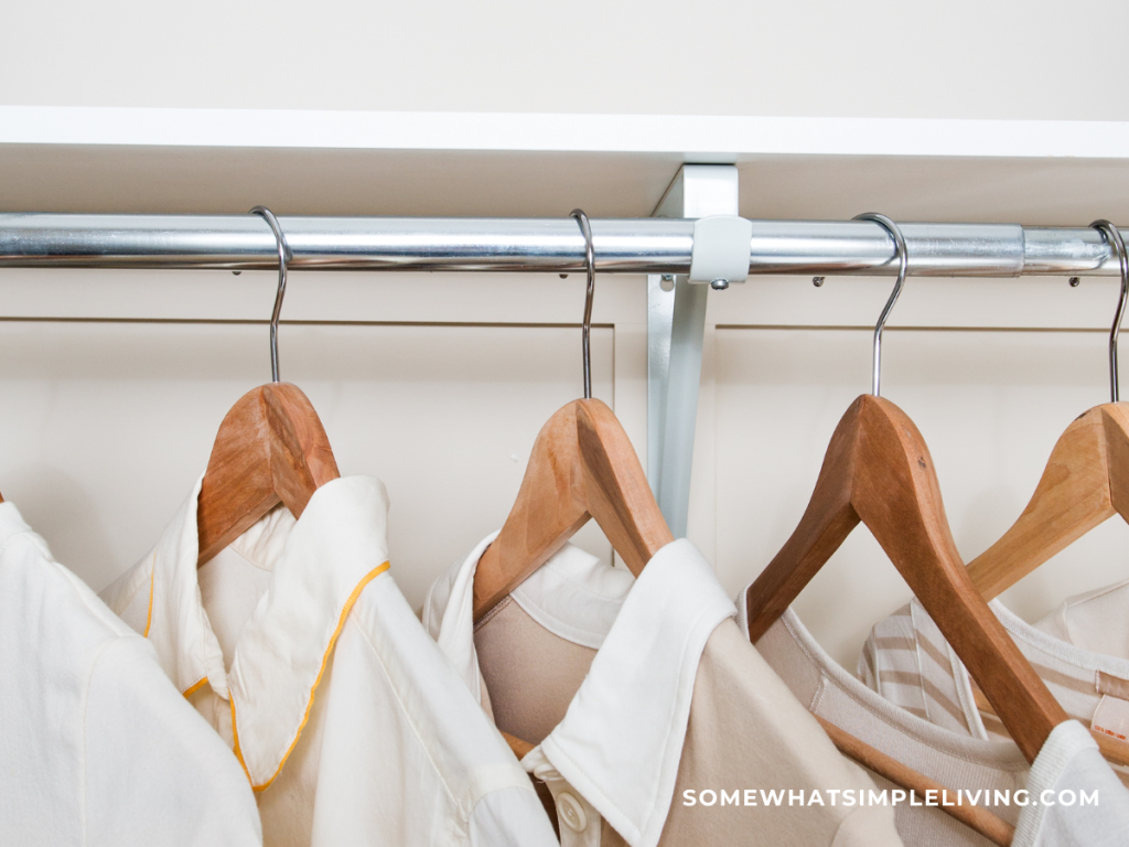 clothes hanging on wood hangers